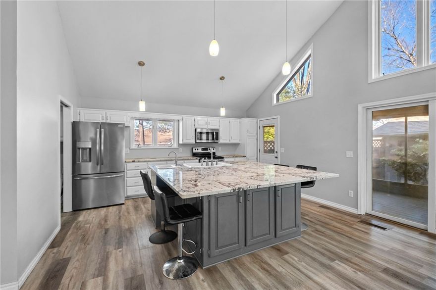 Seller credit up to $7,500. Welcome to 41 Buckingham Dr in Bella Vista located right by Lake Ann and minutes to golf, biking trails, and multiple lakes. Whether you're looking for a full-time home, weekend escape, or short/mid term rental opportunity, this property delivers. This updated 2 bed, 2 bath, and bonus room layout offers flexibility and privacy, with an upstairs room ideal for guests or a home office and a main-level primary suite for everyday comfort. Large windows flood the home with natural light and frame peaceful nature views. The kitchen features granite countertops and modern updates, flowing into your large living room while the spacious sunroom extends your living space year-round. Located in the highly desirable Bentonville School District. Adventure outside. Comfort inside. Opportunity built in.