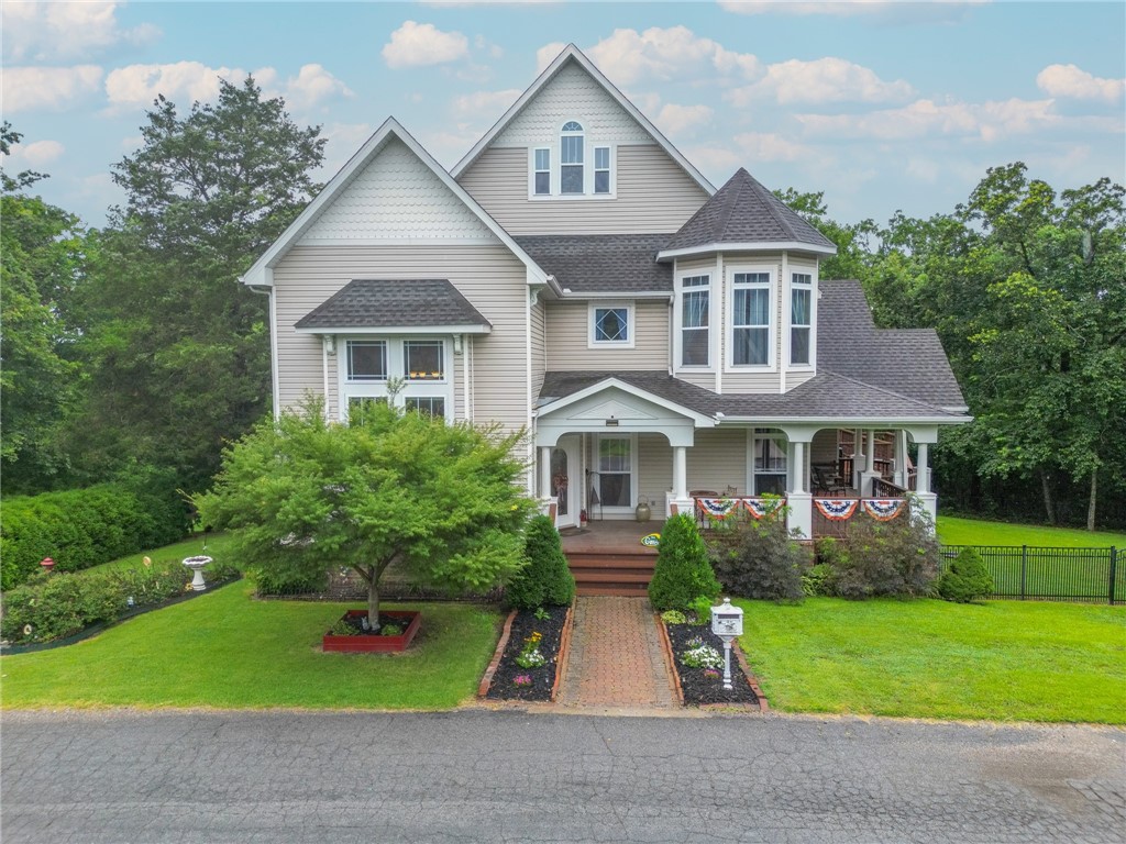 Big wraparound porch, oversized rooms, and three levels of spaceāthatās just the start. This Victorian-style home sits on a large lot and includes the parcel across the street. Inside, youāll find all-new carpet throughout, updated tile in upper bathrooms, and recent upgrades like a new water heater, HVAC systems on both main and upper floors, and a freshly painted interior. The unfinished basement is 768 sqft. Includes a fireplace, Pella doors, a vapor barrier, dehumidifier, sump system, and a newly rebuilt back deck with added stairs leading to a fenced yard. Plenty of charm, tons of updates, and room to grow. Includes lot across the street.