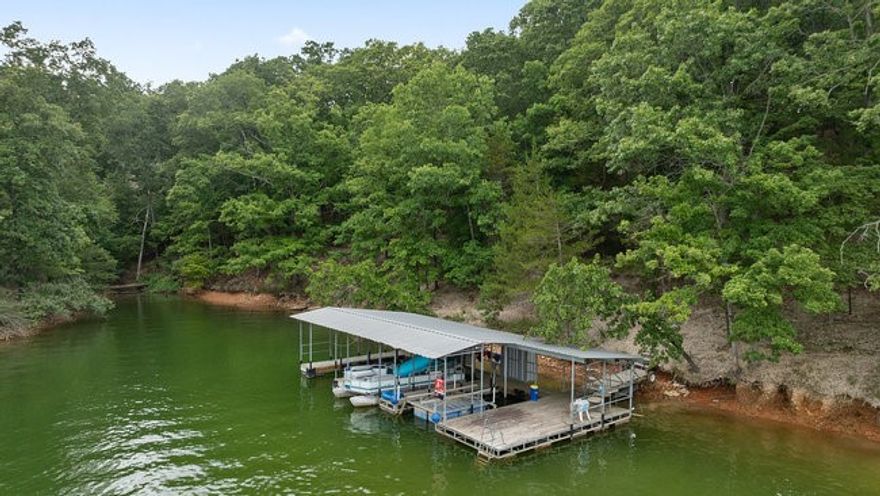 One great price for all three parcels on Beaver Lake! In this package deal, you will receive a 2.53 acre buildable lot with a seasonal lake view to build your dream home. Right across the street and behind the gated entrance, there are 2 separate homes that have been remodeled from the studs up and tastefully executed. Both homes are lake front, and lead down to your TWO boat slips that include a boat lift and 2 jet ski lifts. 10288 Deer Ridge is a One bedroom with a Sunroom and has a modern farmhouse aesthetic.  10229 Deer Ridge offers 3 bedrooms and 2 baths with a cabin chic aesthetic. These are perfect to own for vacation homes or have a multigenerational living situation.  Gorgeous seasonal views of Beaver Lake and a quick 5 minute boat ride to Prairie Creek.  Easy walk down to the lake. Get in touch today for your private showing.