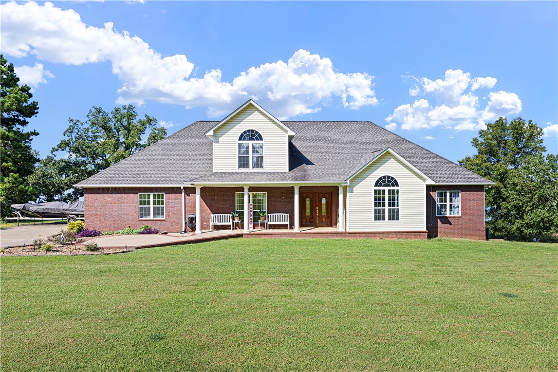 POWERFUL PRESENCE--stunning, cliff top dwelling overlooking the Arkansas River! CUSTOM BUILT home offers sweeping views, waterfront ambience, and golden sunsets. Well-designed aesthetics have maximized its location as a water front domain. Main level offers huge windows and new flooring throughout. Formal dining room, additional coffee bar, massive office with built ins, well-designed kitchen w/ bar, 1 of 2 living rooms are also on main level. Exceptional view of the water from the primary suite--offers a room that is the walk in closet plus an extremely spacious bathroom. Downstairs offers a huge living room plus game/exercise room, bedroom, laundry room, bonus rooms. Walk out to the self-cleaning, saltwater pool with water fall. Extra pavilion for entertaining.
