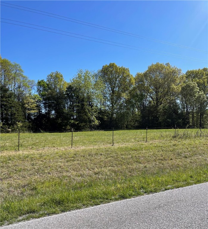 Rural acreage with paved road frontage located approx. 6 miles to Pea Ridge and 20 minutes to Rogers or Bentonville. Several nice building site options with rural water, internet & PH 3 electricity at the road. Pea Ridge school district.