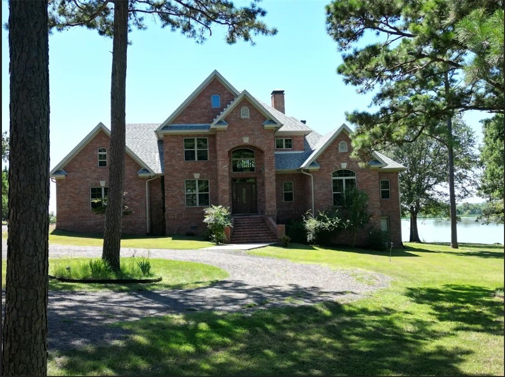 Discover unparalleled luxury in this custom-built 4-bedroom, 3-bathroom home nestled on two pristine acres along the Arkansas River. The cathedral-ceilinged living room boasts expansive windows, offering breathtaking river vistas and an abundance of natural light. Throughout the home, granite countertops add a touch of elegance, complementing the high-end finishes.The stunning primary suite serves as a private sanctuary, featuring a luxurious ensuite bathroom equipped with a jacuzzi tub and a spacious two-person shower, providing a spa-like retreat within your own home.Modern amenities include a brand-new roof installed in 2024 and a Generac home generator, ensuring comfort and security in all seasons. Each morning, enjoy the serene experience of deer visiting your property,