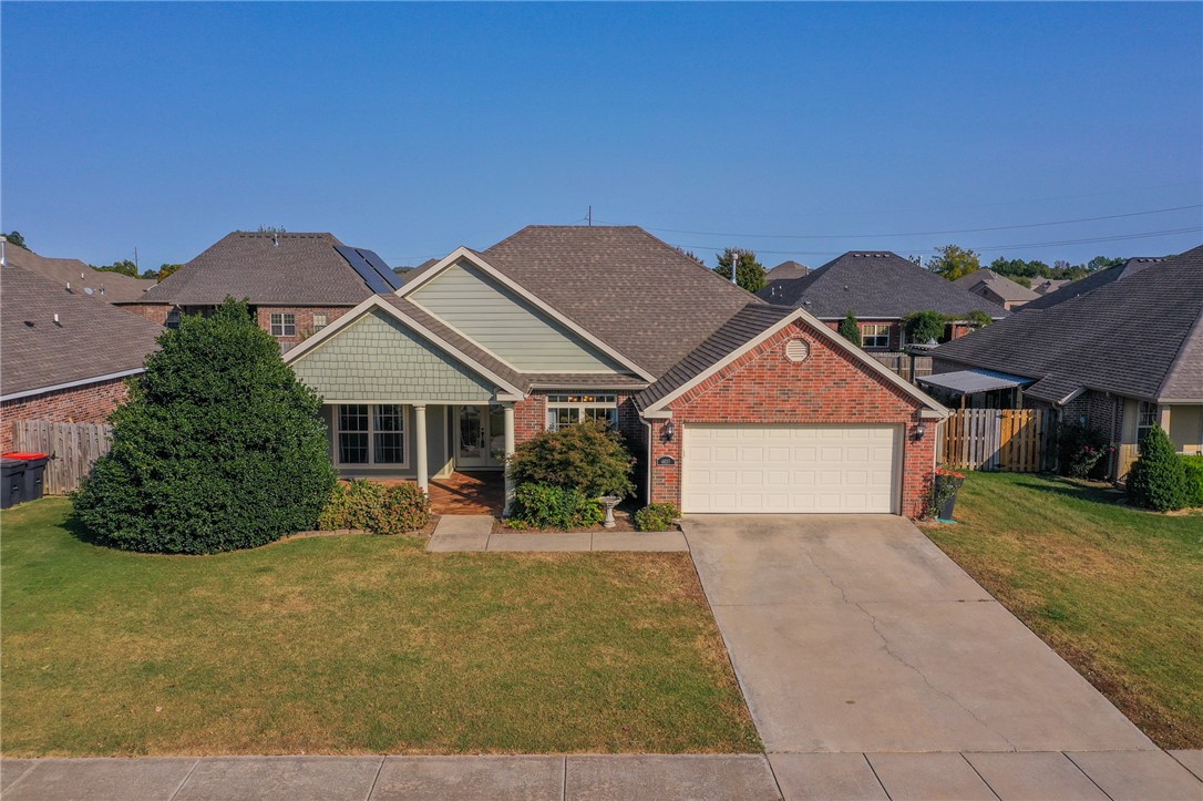 This is the perfect home for anyone looking for outdoor living space, a convenient location, a functional floor plan, and wonderful neighborhood amenities. This house is right across from the Legendary clubhouse, pool, and sports fields, all within walking distance! The covered front porch with stained concrete is amazing...not to mention the double glass front doors that lead into an open living space with split bedrooms. Hardwood floors, New Carpet in the bedrooms, established landscaping, and a practical, roomy floor plan make this house super desirable. It also has a covered back patio plus a huge storage shed or workshop. Walking distance to the new Shaw Park and close to the 612 bypass. It's hard to find so many great things in one house at this price point! Additionally the Refrigerator, Washer, and Dryer convey with an acceptable offer!