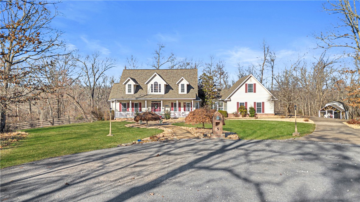 Here is the dream home you have been searching for 4 bedrooms , and 4 bathrooms,the main bedroom on the first floor with an office/bedroom, a full dining room, an eat-in kitchen, 2 upstairs bedrooms, beautiful finishes and built ins, a Huge finished bonus room above the garage, a front porch and back porch plus 5 private acres to call your own! Backyard is fully fenced in for your pets and 3 acres of the 5 are wooded for you to explore. A beautiful one-of a kind setting in a wonderful easy to access location. Additional features are the barn, the additional storage building the 3 car garage and the enclosed breeze way from the garage to the laundry room. Unique one if a kind and ready for a new family to call theirs.
Privacy, quiet, and still only 5 minutes to interstate i-49 giving you easy access t everything Bella Vista, and Northwest Arkansas has to offer! This is a truly one-of a kind home
