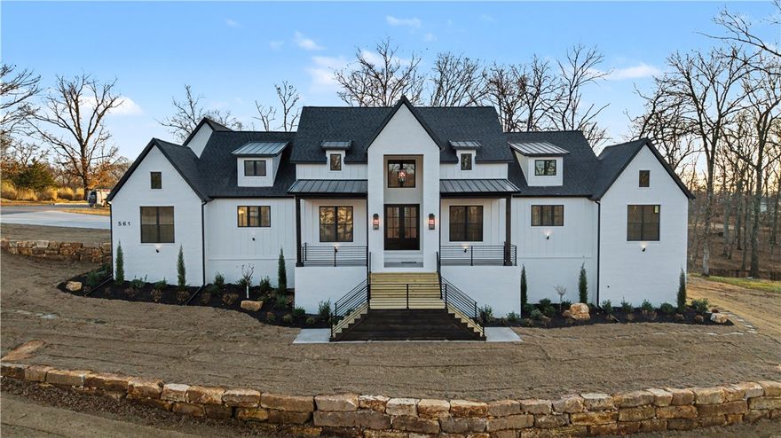 This custom built home offers everything...Come home to Shelby Forrest subdivision, NWA's new luxury getaway, large lots with lots of trees and privacy. Built on a large corner lot, this home offers an open floor plan, Taj Mahal quartzite throughout the home, a gorgeous chef's kitchen featuring a 48 inch 6 burner + griddle range and pro vent hood, 2 dishwashers, a large farmhouse sink + prep sink, a 60 inch fridge/freezer and large hidden pantry, massive primary suite with stunning walk in shower and a showstopper closet, beautiful white oak hardwood flooring throughout the home. The large upstairs bonus room has its own bathroom and could be a 6th bedroom. The sheer amount of closet and cabinet space will amaze you. Also features an office/5th bedroom, large laundry room and an outdoor patio space that will impress anyone. Located just 5 minutes from downtown Rogers and 15 minutes from downtown Bentonville