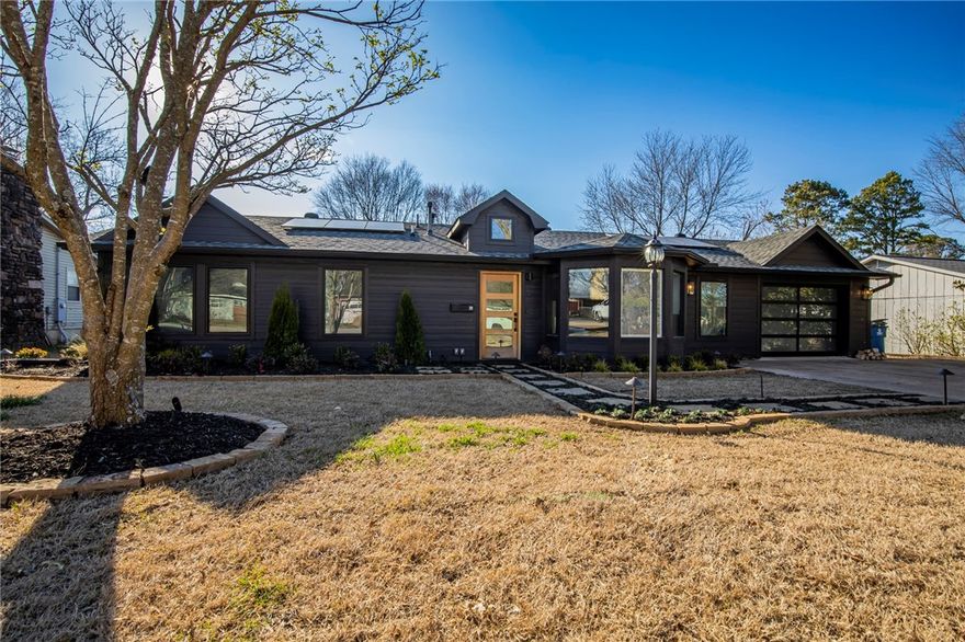 Newly remodeled home in Downtown Bentonville with 3 bedrooms, 2.5 baths, sitting on a .27 acre lot.  High end finish outs include custom kitchen cabinets with granite counter tops, French oak hard wood flooring, remote control blinds, solar panels with back up generator, heat system on the covered back patio, electric car charger in garage, sonos audio system, newly landscaped front yard with sprinkler and drainage system, and landscape lighting.