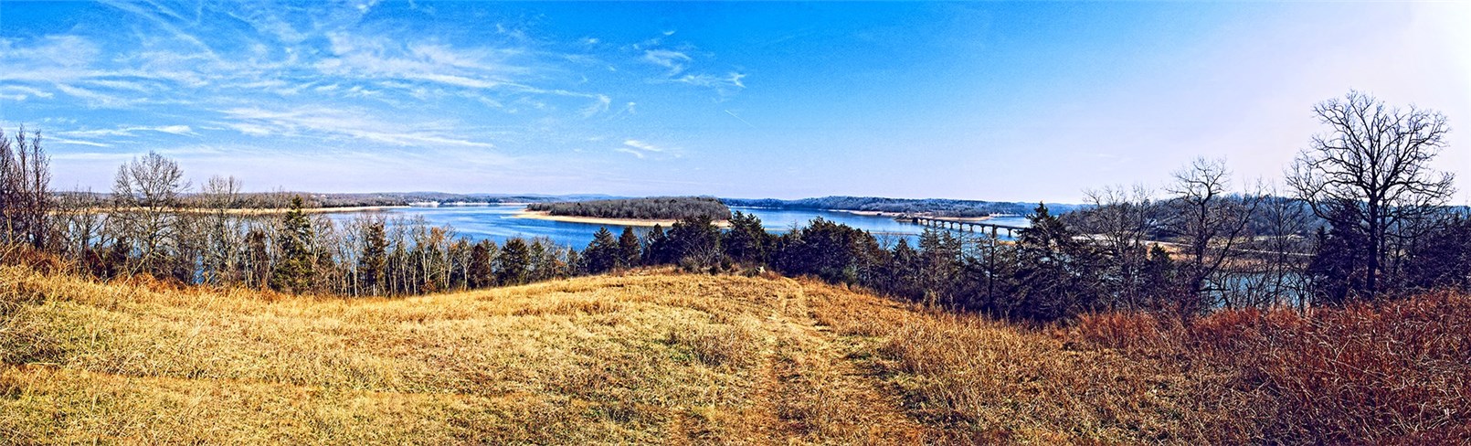 This unique property is a MUST SEE! Two premier lots being sold as one(1.90 acres +/-), located on the tip of Serenity Point Ln., on beautiful Beaver Lake. This land features a 270 degree unobstructed view of the water below and an easy-access trail leading down to a 30'x41' 2-slip boat dock which conveys with the property. The land is also utility-ready. Located only minutes away from town, this spot is the ideal place to build your dream home! Buyer to confirm all utilities.