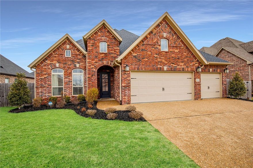 The openness of this home is great for entertaining. The dining room, family room, and breakfast nook all surround the centrally located kitchen. The windows in the family room overlook the large, covered patio showcasing a corner fireplace. The private owner's suite is just off the kitchen, and features two vanities, corner tub, frameless glass/tiled shower, and large walk-in closet. There are also three additional bedrooms and two additional full baths on the main level. The kitchen features a large, walk-in pantry, gas cooktop, and abundance of cabinets and counter space. The second floor boasts a bonus room, half bath, closet and easy access to attic storage. Three-car garage with epoxy floor and standup Storm Shelter.  The Floor Plan for Buffington’s Madison Plan with room measurements is provided.  Home is within walking distance to Central Park Elementary School, Bright Field Middle School and Fulbright Junior High.  Less than 2 miles to the Bentonville Community Center for recreation and fitness activities.