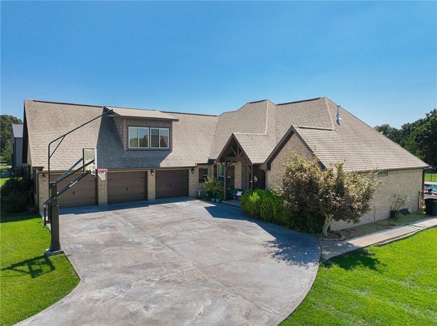 Welcome to your dream home in Pea Ridge! This stunning home sits on a sprawling 5 acres & boasts 2,909 sq ft of meticulously designed living space. Step inside to discover a spacious living room featuring beautiful built-ins & a cozy fireplace. The kitchen is a chef’s delight with custom cabinets, an island, & a large pantry, plus an eat-in area perfect for family meals. The master suite is a serene retreat with large windows for incredible lighting, a walk-in closet, & a beautifully tiled shower in the en-suite bathroom, complemented by a double vanity. A versatile bonus room near the entrance serves as an ideal office or additional living space. Outside, the property truly shines with a pristine in ground pool, two expansive covered patios for entertaining, & a 2000 sq ft shed equipped with solar panels & a game room upstairs. Additional features include a brand new roof & gutters, 1000-gallon propane tank & a tornado shelter, ensuring comfort and safety. Located just minutes from Pea Ridge Military Park.