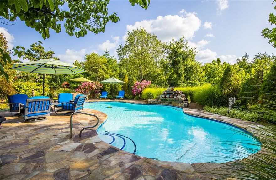 Ultimate privacy and stunning elegance in exclusive PCC. Gorgeous Oasis Backyard featured In 2011 AR Gardener Magazine. Rotunda style grand living room with plenty of windows that BRING THE OUTDOORS IN! Split floor plan with mother-in-law suite on main level. $300K+ in upgrades include mature professional landscaping, private in-ground pool, covered patio retreat & outdoor fireplace. Feel like you are living in your own private resort!