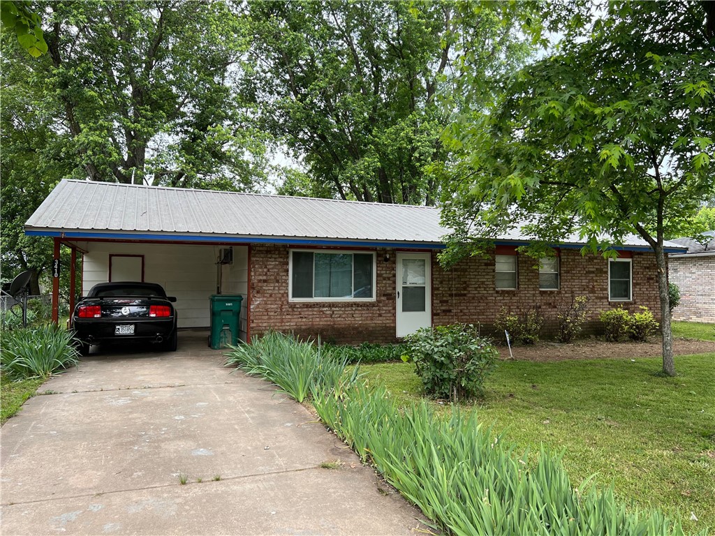 Check out this fixer-upper in a very convenient location! The house has a metal roof, new-er windows (most of them), 7 year old water heater, 5 year old furnace. Window units cool the home (no central air, but could be added). The home could use a deep cleaning, new flooring, and a couple coats of paint along with some cosmetic improvements. For a house in this price range, the neighborhood is pretty decent! Storage sheds in the huge back yard convey!