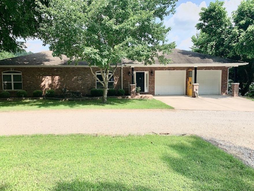 Beautiful Lake Front Property located in the Grassy Knob community. Ranch style home with walk out basement & attached 2 car garage, located on a quite dead-end road. There is plenty of flat space for additional parking.  9' ceilings throughout. Has energy efficient Heat pump. There are 3 lg Bedrooms & 3 1/2 Bathrooms on the main level, with additional 2+ lg Bedrooms & 2 Bathrooms on the lower level. 6-person Hot tub on upper deck with easy access to Master Bathroom. Newly renovated lower level has 2 Bonus rooms, would be ideal for a home theater, home gym or office space. The lower level also has a large Family room and Game room which walks out to a 25x33' patio. The home has 2 working fireplaces. Upper deck is 10x80’, lower deck is 8x84'. We are on Community water. Approximately 251' of lake front, with year-round views. Gentle walk down to Private 2 slip boat dock with a seldom found covered 16x18' Patio. It has a 10x28' slip with lift and a 10x16' slip than can easily hold 2 Jet ski's or a fishing boat.