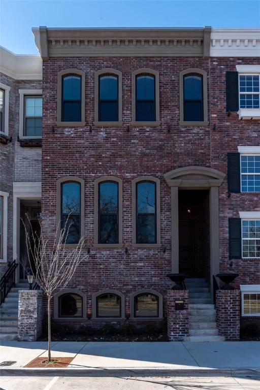 Enjoy the lifestyle and culture of downtown living a short distance from shopping, restaurants, and events. Pick your finishes in Downtown Bentonville's prestigious Brownstones. These luxurious townhomes feature an amazing layout throughout three levels. An English basement provides a great multi-purpose space with a bedroom and full bath that can be used as a guest suite or a home office. The main level is the living space and is perfect for entertaining with 15 ft ceilings, large windows, and an open layout between the kitchen, dining, and living space. Master bedroom has 10 ft ceilings and an attached master bathroom. Large balcony is an ideal spot to relax and enjoy the views of downtown. Two guest bedrooms on upper level provide plenty of space. Call the listing team today for a private tour and choose from available wood flooring, granite, lighting, upgraded appliances, and plumbing fixtures to create the space that fits your style.