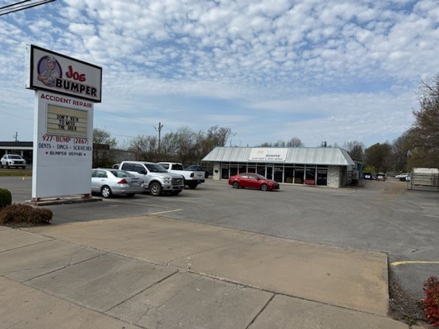 Large 5,530 SF, well maintained commercial building on 1.15 Acres. Premium automotive sales/repair location with 71B frontage. Tenant occupied. Currently home to a 25+ year auto body repair facility. Located just off the corner of Don Tyson and 71B. This location has a proven track record in the automotive service industry with excellent client visibility. 6 service bays and 1,600 SF office and retail space. Large customer parking in front and fenced holding lot in the back. Agent Owned