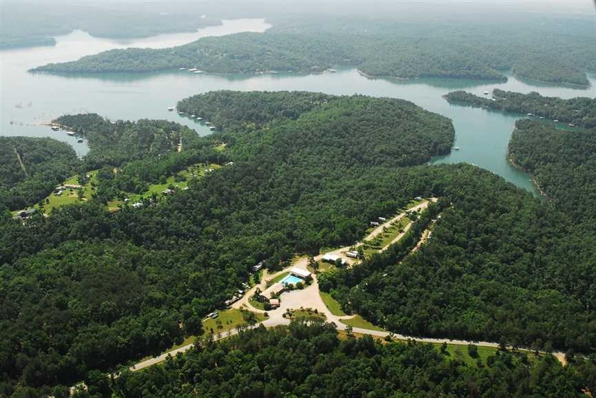 25 acre commercial Campground and RV Park. Property has a commercial dock permit from the Corp allowing for as many boat slips as the campground has campsites. Currently, their are 2 docks that have enough space for 10 boats. 87 Full Service 30/50 Amp RV hook-ups, Tent Sites near restrooms & hot showers, 2 Rental Cottages, 6 Cabins, Convenience Store & Gift Shop - Laundry, Large Pavilion, Recreation Room & Playground, Swimming pool, Family / Group Meeting Room, Scenic Lookout.
