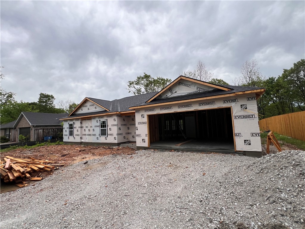 Great 2 bed 2 bath with an office/bonus room new construction built, on a quite street with brick & cement siding home. This open space property comes with 9' ceilings, granite kitchen countertop on a good size, treed flat lot with a covered patio, in thriving Bella Vista. It's close to the Missouri border 20 mins away from Downtown Bentonville & next to a bunch of walking/biking trails, Lake Loch Lomond & all the amenities Bella Vista has to offer it's residents. Short drive away of where Runway/Blue Crane Development are planning on their most ambitous project to date. Heated 1380 sf and 1990 under roof. Reach out with any question on the finishes. Scheduled to be completed by June, if weather permits. Taxes are for the vacant lot and no improvement.