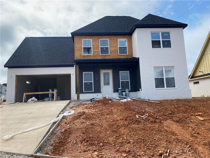 Discover this beautifully designed new construction home in the heart of Rogers! Featuring 4 bedrooms, 2 full bathrooms, and a versatile bonus room upstairs—perfect for a media room, second living area or whatever you can dream up! The open-concept layout includes a bright, eat-in kitchen with modern finishes, ideal for everyday living and entertaining. Enjoy a prime location within walking distance of the Rogers Aquatic Center and just minutes from shopping, dining, and entertainment. Thoughtful design, quality craftsmanship, and unbeatable convenience make this home a must-see!
