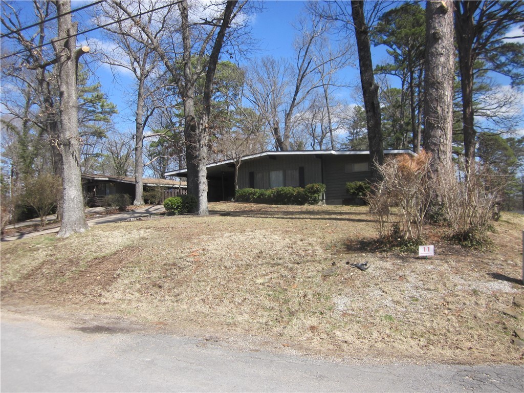 Convenient location, close to 71B. Large patio for gatherings/cookouts. Large craft room (18X16), could be office or workshop. Large windows bring the outside in. Outside storage room (8x8) off carport.