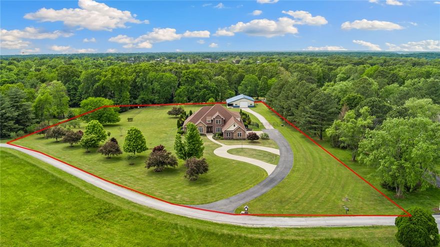 Ready to stop sharing your personal space with the house next door? Nestled on a sprawling 4.15-acre estate this home is 14 minutes from the new Walmart Home Office, Crystal Bridges and Downtown Bentonville, 16 minutes from the Walmart AMP and 5 minutes from downtown Rogers. Step inside this spacious home with multiple living areas to suit every need: a cozy retreat conveniently located off the kitchen which has newly painted cabinets, a formal den in the center of the home and an upstairs bonus room. Also on the main level is the formal dining room, breakfast nook looking out onto the pool, a private office and primary bedroom with dedicated hot water heater & HVAC, en-suite bath and cozy fireplace. Step outside and be captivated by the lush landscaping with irrigation, saltwater pool and Tuscan fig trees. There's more! An attached 4 car garage and a 40x50 steel-framed shop with 1/2 bath, foam insulation, central heat/air, convenient 12 x 16 tall shop door and a lean-to providing additional covered storage.