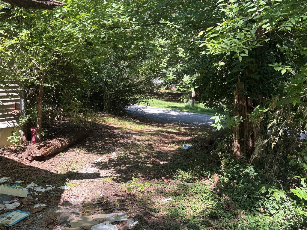 If you are looking for a rare opportunity in NWA, an affordable investment with lot of upside potential, look no further. While this mobile could probably be salvaged, no value is placed on the structure. Sold as is. The lot has road frontage and drive access on 2 roads and IS situated in the Bella Vista POA so you'll have access to amenities and it's just around the corner from biker trails, restaurants and more!