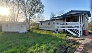 You will absolutely love the vibe in this well maintained home with it Pioneer Woman feel and its small town charm. Includes a new 16 ft outbuilding and a large front deck.