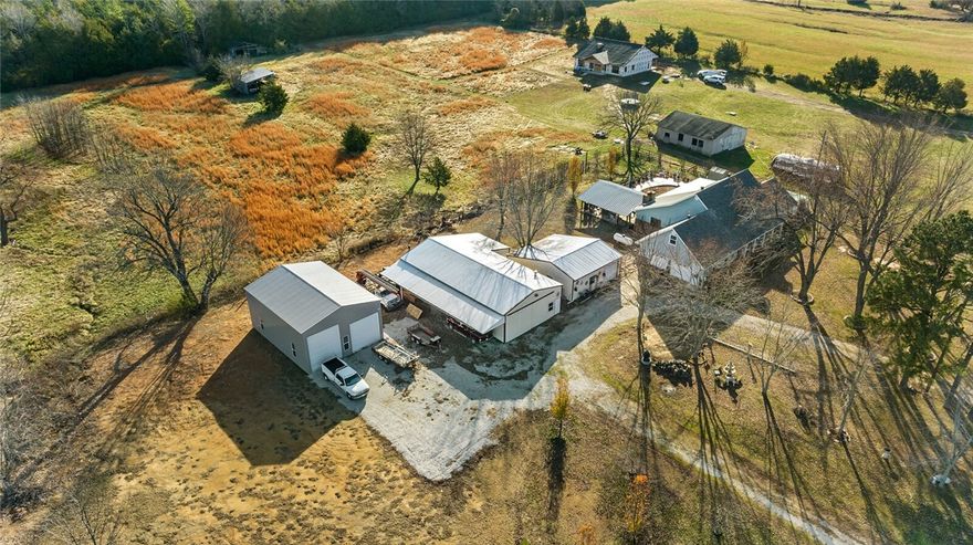 SELLER MOTIVATED!! Assumable FHA loan available at 3.125% 
Looking for a strategic location to launch or expand your business?  With no deed restrictions, this 2.67-acre property offers unparalleled versatility and a prime location just off the interstate. With a spacious home and 3 oversized outbuildings, this property is ready to accommodate a diverse range of businesses. 
The upper level features a separate apartment with 3 bedrooms, full kitchen, living room, washer & dryer, and its own private entry. The lower level offers a spacious living room for family gatherings opening up into a large kitchen with plenty of counter space and storage. The main bedroom has a custom porcelain walk-in shower and large walk-in closet. 

3 outbuildings: 
30 x 60 heated and cooled with an office and a half bath perfect for mechanical work, woodworking or welding.
30 X 40 outbuilding is a 2-bay RV and boat storage
30 x 24 shop/shed 
3-phase electrical lines are running out at the road to tap into