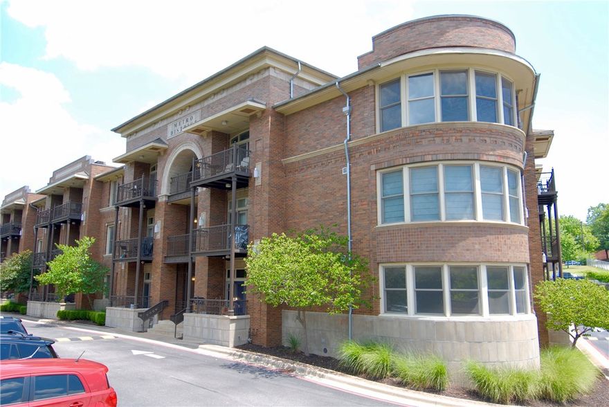 Updated 2nd floor condo in the heart of Fayetteville's proposed Cultural Arts Corridor.  This 2 bed, 2 bath has a wood floored living/kitchen, updated quartz kitchen counters, gas stove, stainless appliances and gas log fireplace opening on to a private patio.  The large master suite has a walking in closet, tiled bath with separate jetted tub and shower, dual vanity sinks on granite counters.  There is ample storage and a washer and dryer. 1 reserved parking space.  Building is gated w/video security