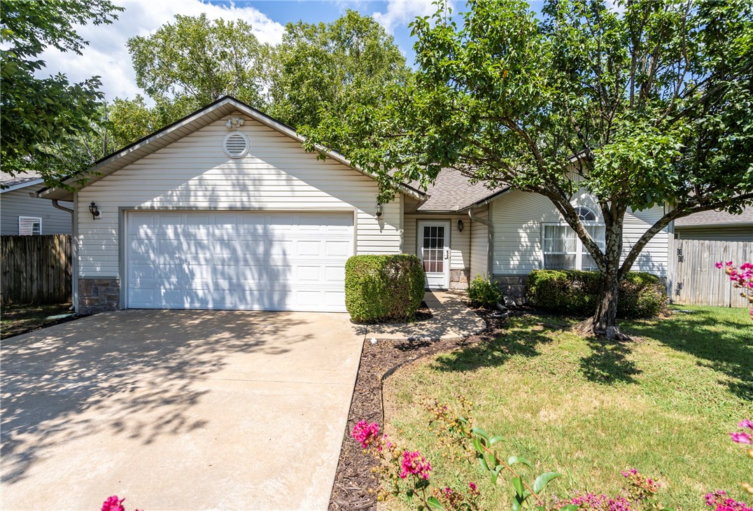 Welcome to this charming and cozy 2 Bed 2 Bath home with an oversized two car garage, mature landscaping, privacy fenced backyard that backs up to a wooded field, and is conveniently located to schools, shopping, hospital and downtown Siloam Springs! Inside, you will find a warm and inviting open layout with cathedral ceilings, an attic fan, arched doorway in primary, eat-in kitchen, pantry, built-in lazy susan, window above kitchen sink, bar seating, gas stove, walk-in closet and shower in primary bath. Outside of home has motion lights, patio area with a built-in gas grill, gutters, starburst half moon front window design, new roof 2022, built-in Generac generator in garage, new hot water heater in 2022 and a storm door. The generator hasn’t been used since 2008 and probably has a bad battery. This could be the perfect place for you to call home! Don’t miss your chance to see it!