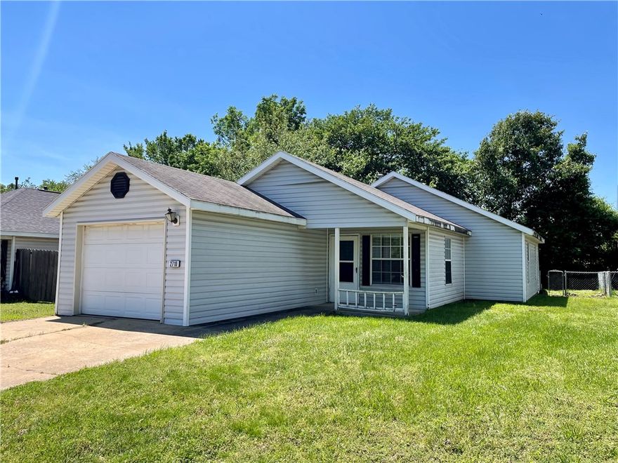 Located in North Springdale, this inviting home offers comfort, convenience, and value at a great price point. Featuring 3 bedrooms and 2 full bathrooms with combo tub/showers, the layout includes a spacious living room and an eat-in kitchen perfect for everyday meals and gatherings. Enjoy outdoor living with a welcoming front porch, back patio, and fenced backyard ideal for relaxing, play, or entertaining. Conveniently located near Hwy 71 with quick access to restaurants, shopping, and more, this home is approximately 2 miles from downtown Springdale and near Lowell and Hwy 265 for easy access throughout Northwest Arkansas. This property also includes a one-car garage for added storage and functionality. Whether you're searching for a home or adding to your investment portfolio, this property offers plenty of potential. Move in and make it your own while enjoying all that this central location has to offer.
