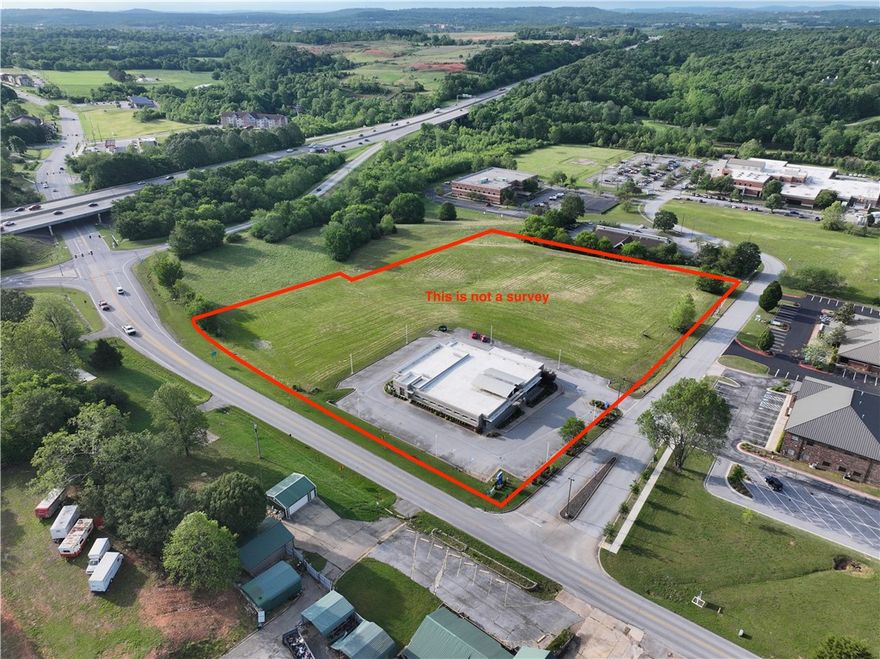Prime Northwest Arkansas Commercial Opportunity! This exceptional 5 +/- acre property boasts a strategic location right off Interstate 49, offering unparalleled access to the entire Northwest Arkansas region. Featuring a substantial 9,634 sq ft building with multiple potential uses and desirable TC zoning, this site offers significant development or investment potential. Enjoy excellent visibility with approximately 600 feet of frontage on Willow Creek Drive and 400 feet on Johnson Mill Boulevard. Situated moments from Willow Creek Hospital, and offering arguably the best on and off interstate access along I-49, this is a truly premier location. Ability to buy just 3.26 acres of land MLS 1282936