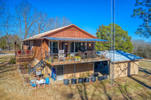 You will enjoy the privacy of this very nice 3 bedroom, 2 bath home on 7 acres with views of the Gaither Valley from the large living room windows. The home has a full mostly finished basement, 2 car attached garage, 30x40 insulated work shop, a newer roof, good garden spot, and large covered porch with breathtaking views. On a paved road just a short distance from town.