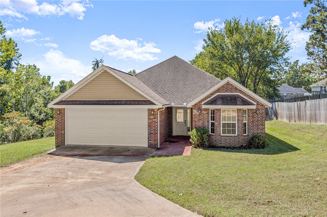 Move In Ready 3 Bed/2 Bath home on 1.18 Acres in Rogers! Conveniently located off Hwy 62/Hudson. Enjoy a secluded setting surrounded by woods. This home features a spacious 1,474 SF open living space, great for entertaining with a large kitchen bar and dining space. Foyer entry welcomes you in. Two guest bedrooms and a guest bathroom on the right of entry. Large living room has ample seating space and a cozy gas fireplace. The kitchen has great workspace and pantry, eat in kitchen area has large windows looking out to your wooded acreage. Primary bedroom has great space and WIC! Primary bath features a whirlpool tub and separate shower. HVAC replaced in 2021. Beautiful backyard with your very own peach tree! Easy access to Downtown Rogers shopping, dining, and entertainment! Welcome home!
