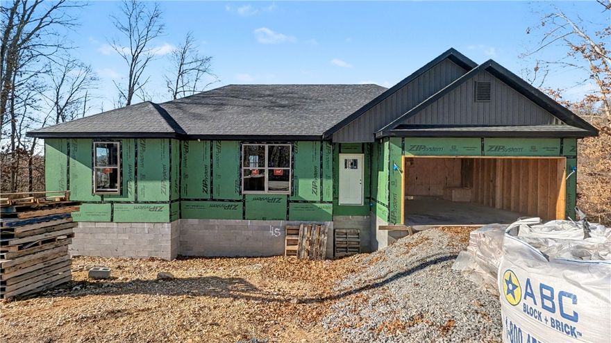 Welcome To Your Next Home! Zoned For Bentonville Schools And Surrounded By Some Of The Best Mountain Bike Trails In Bella Vista, This One Nails The Sweet Spot Between Location, Layout, And Lifestyle. Step Inside To 9 Ft Ceilings, A Bright Open Living Area, And A Super Functional Floorplan That Makes Easy Furniture Placement A Total Breeze. The Corner Fireplace Sets The Mood, While The Kitchen Brings The Heat With Custom Cabinets, Granite Counters, Tile Backsplash, Under-Cab Lighting, Pantry Storage, Island Seating, And A Sunny Eat-In Dining Area. The Primary Suite Is Built For Real-Life Comfort With A Walk-In Closet, Soaker Tub, Tile Shower, And Dual Vanity. Two Secondary Bedrooms + A Full Hall Bath With Double Vanity Give Everyone Space To Spread Out. Out Back, Enjoy A Covered Deck Overlooking A Fresh, Sodded Yard—Perfect For Weekend Grilling, Morning Coffee, Or Post-Ride Relaxing. This Floorplan Just Works, And This Location Is Hard To Beat! Wrapping Up Jan/Feb. Still Time To Make Interior Selections