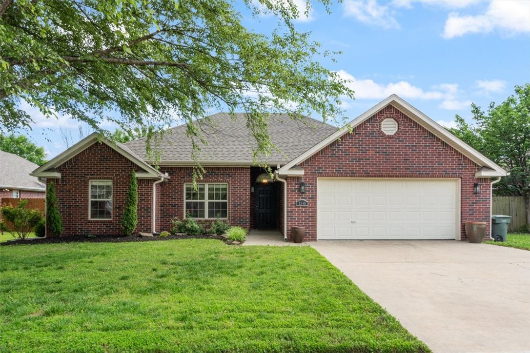 Welcome to this inviting 3 bed, 2 bath home in a quiet neighborhood near schools, parks, and trails. The home's thoughtful layout feels open and spacious. The living room features tall ceilings, wood floors, crown molding, and a cozy gas-log fireplace. The kitchen offers ample counter space, a pantry, and a functional design for daily living and entertaining. The split floor plan provides privacy for the generously sized primary suite, which includesĀ a tray ceiling, en suite bath, and an oversized walk-in closet. A dedicated laundry room offers extra convenience, and the covered back deck provides a shaded spot toĀ unwind. Located near the Rupple Road trail, Clabber Creek trail, Gary Hampton softball complex,Ā schools, and less than 5 miles from the U of A, with easy access to I-49. New roof and gutters in 2020, front landscaping and paint in 2022. Don't miss this adorable home before it's gone!