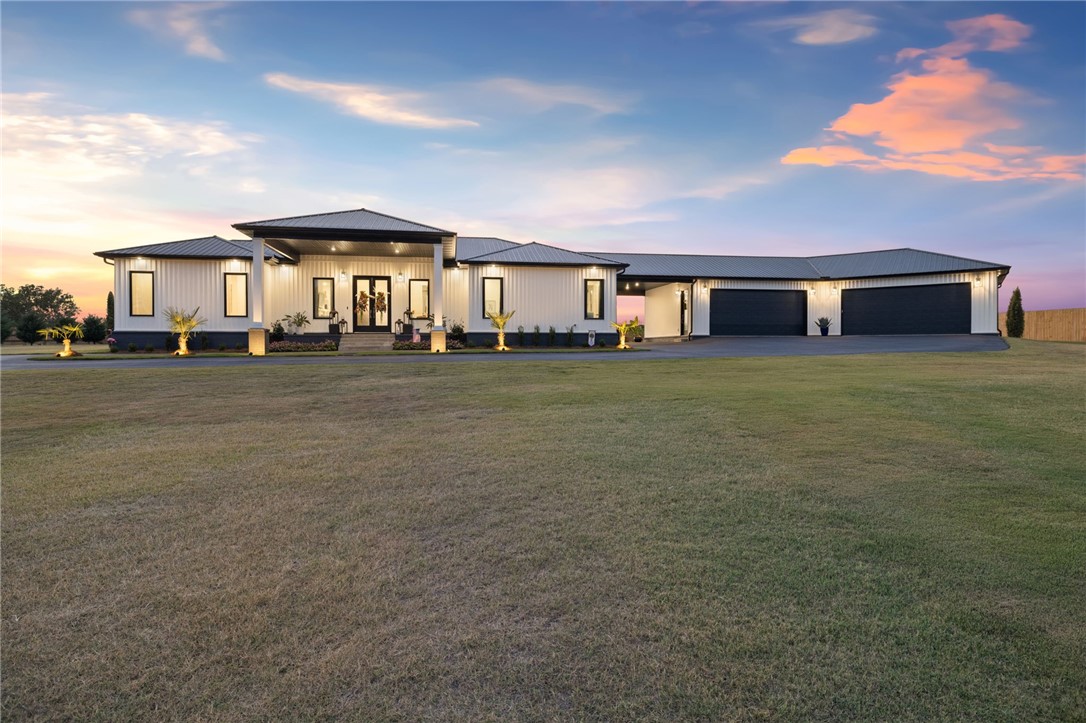 This custom-built 4-bed, 4.5-bath luxury home offers high-end living with thoughtful upgrades throughout. The open layout is perfect for entertaining, w/ 10 ft ceilings, all-wood cased windows, a chef’s kitchen featuring dual ovens & a hidden walk-in pantry. The spacious primary suite includes an attached office with 2 desks, a walk-in closet w/ natural light, & a high-tech shower. Every bedroom has an en-suite bath & built-in desks. The home’s outdoor living is unmatched, w/ a heated saltwater pool, private fishing pond, and a golf green. The oversized 4 car garage is a showstopper with epoxy-coated floors, oversized powder-coated garage doors, & is fully insulated, heated, and cooled. It also includes a spacious storage room with shelves from floor to ceiling. Additional highlights include 2 laundry areas, a central vacuum system, & an electric gate with a keypad & remote. This one-of-a-kind home is designed for both style & functionality, making it the ideal retreat for those seeking a high-quality lifestyle.