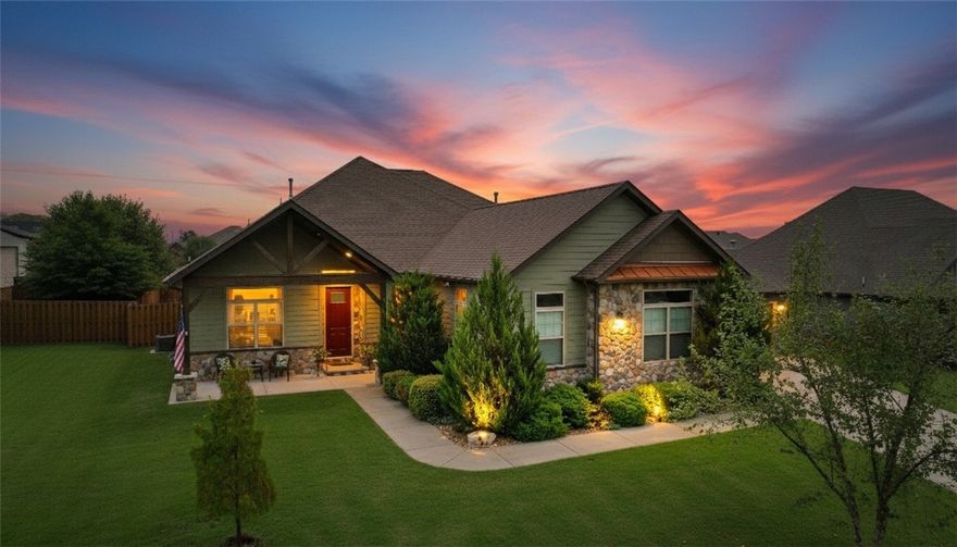 Framed by stone and cedar, this modern rustic beauty stands out with beautiful design touches. This one level, open floor plan features cedar beams, wood floor, a stacked-stone gas log fireplace. An eat-in kitchen boasts a large island, 5-burner gas stove with pot filler, a pantry & coffee/wine bar area. The primary suite is a true retreat with a whirlpool tub, walk-in shower with dual heads, dual vanities & a spacious closet with built-ins. There are 3 more bedrooms, 2 additional full baths PLUS an office. A covered patio provides great entertaining space. Enjoy cool nights sitting by the outdoor stone fireplace or grilling steaks at your outdoor kitchen. Highlights: tankless water heater, exterior uplighting, irrigation system, central vacuum & 3-car garage with epoxy floors. Cook smores in fireplace or picnic at the community pavilion. Ideally located near I-49, XNA, Bentonville West High, Coler MTB Preserve, and WMT Global Campus—all within 10 minutes. One owner home. See Feature Sheet for even more information
