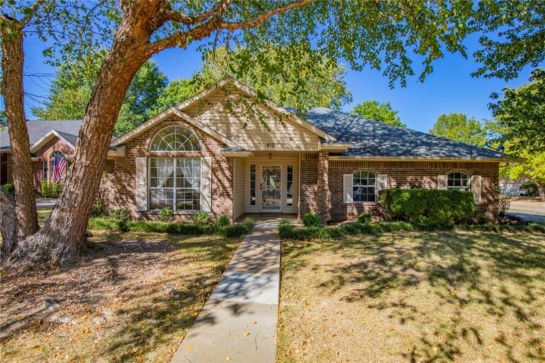 The location can't be beat on this wonderful home in a nice established neighborhood near shopping, restaurants, movie theaters, schools, medical services, minutes from Scottsdale and Pinnacle promenade shopping and near the interstate to quickly access your favorite areas of NWA. This well maintained home is on a large corner lot and cul-de-sac with sidewalks to take your daily walks. You will enter into a large living room which leads into a spacious sunroom to enjoy the outdoors comfortably from the inside. Your sunroom leads into a nice spacious backyard for your enjoyment for your barbecues with family and friends under the pergola which conveys with the home including the patio furniture and grill. The home boasts an updated kitchen with granite countertops and the refrigerator conveys. There is a large dining area right by the kitchen which looks into the spacious living room. The three bedrooms are nice sized with lots of outside light in each one. Schedule your showing today before this one is snatched up!