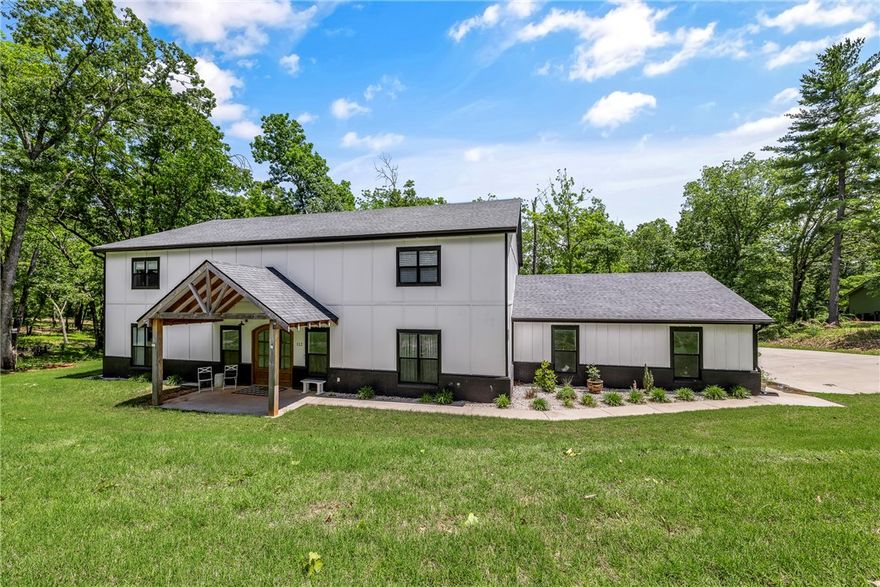 HYLAND PARK — Contemporary Farmhouse on 2+ Acres with Workshop.
Welcome to this beautiful, modern farmhouse in the heart of Rogers—just minutes from downtown and Prairie Creek Boat Dock. Situated on over 2 acres, this home offers a perfect blend of comfort and style. Enjoy the open-concept layout with a spacious kitchen, walk-in pantry, commercial Frigidaire appliances, large island, and breakfast bar. The cozy living and dining areas are ideal for entertaining. The primary suite features a soaking tub, large shower, and walk-in closet connected to the laundry room. There's also a guest bedroom on the main level. Upstairs offers a media room, Jack-and-Jill bath, and more bedrooms. Step outside to a covered patio and an incredible 40x60 workshop with an in-law apartment and full kitchen. Endless possibilities for families, hobbyists, and entertainers.