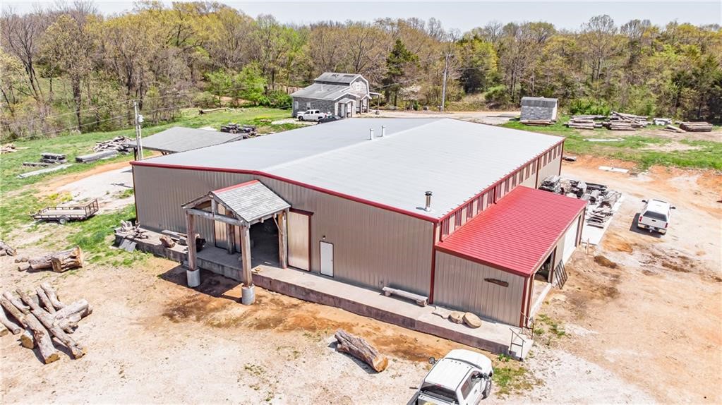 Don't miss this high-visibility property on Hwy 62! With around 8 acres of flat, cleared land, this property offers a 9,000 sqft shop, updated and ready for your next venture, plus a cabinet-making shop. The property also includes a house and outbuilding, adding even more potential for future use. Act now to seize this unique opportunityāproperty only, business and equipment are not included. The current owner will lease back the property for 6 months. Business is for sale, but offered under separate terms.
