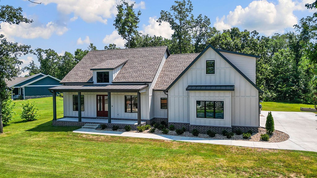 Custom-built in 2023, this beautifully maintained 3-bedroom, 2-bath home is better than new and sits on 3 lots. It has a bonus room with a closet—ideal for a 4th bedroom, office, or guest space. The upstairs bonus room has a minisplit for heating and cooling. Don't miss the oversized laundry room which adjoins the master closet and mudroom off the garage entrance. The bright and open kitchen features a large walk-in pantry with a window. Situated on a total of .8 acres, this property offers privacy with mature trees surrounding a spacious yard. Inside, you’ll find high-end finishes throughout, including Hardie Plank siding, modern fixtures, and an open-concept layout. Outside, enjoy a huge flat yard, oversized concrete patio, and an oversized driveway with extra parking space. Located less than 5 minutes from Branchwood Recreation Center, Tiree Park, Lake Loch Lomond, and mountain bike trails. This home blends comfort, style, and outdoor adventure.
