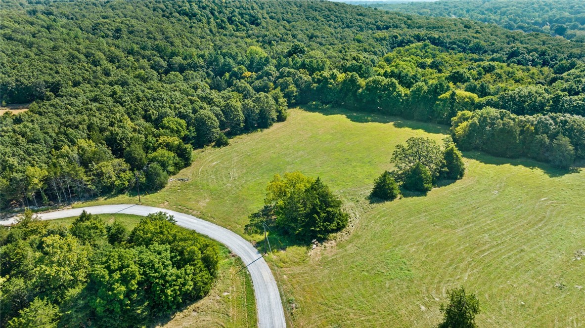 Located in Goshen Arkansas and in the Fayetteville School District you will find a rare opportunity to build your custom home on a private five acre lot located in the prestigious Cedar Ranch Estates. Designed to preserve the natural beauty and privacy appreciated in the Goshen area, and with opportunity to design the perfect dream estate. Each lot is uniquely different ranging from beautiful valley views, to stream side oasis, to pond side elegance, to rolling grassy fields. With each lot you will have the opportunity to create a home on an estate sized lot with the unique features desired by everyone. Come visit Cedar Ranch Estates and make it your last home.