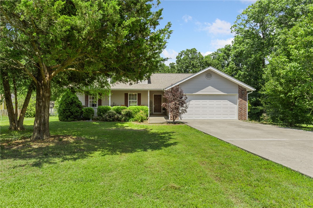 Charming 3BR/2BA single-level ranch home in Stonegate Subdivision, perfectly situated between Harrison, AR, and Branson, MO. This inviting home features an open floor plan with cathedral ceilings, a modern kitchen with beautiful cabinetry, and a spacious master suite with a jetted tub. Enjoy a newer roof, updated central HVAC, and a large deck overlooking a private, wooded 1.85-acre lot. Complete with a 2-car attached garage, concrete driveway, and a storage shed, this well-maintained home offers comfort and convenience in a quiet neighborhood.