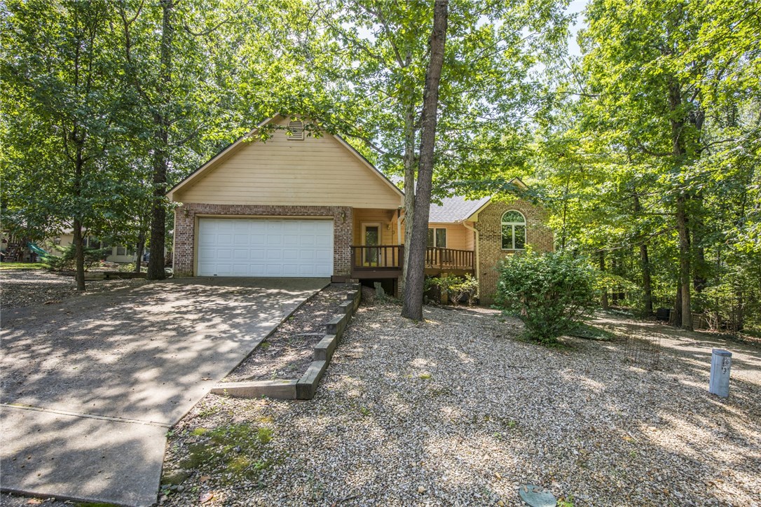 Quality built, unique floor plan. Park like setting on a quiet cul-de-sac. Bike trail directly behind the property. Newer bamboo flooring in the vaulted, open living room. Pretty gas log fireplace and lots of windows. Kitchen features Granite counter tops, pantry and great Breakfast bar. Formal dining adjacent to kitchen and covered porch. Both baths have been smartly update with tile showers. Bedrooms are nice sized, one opens out to deck. Fenced private backyard with grass and large trees. Furniture is negotiable. On Vacation Rentals program