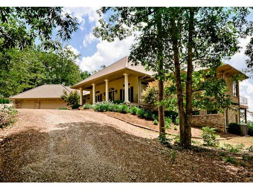 Beaver Lake Estate, 20 Acres of beautiful Ozark Mountain property complete with private boat dock. The energy efficient home was completed in 2009 and has to be seen to be appreciated. Amazing views from nearly all rooms in the house, not only of the lake,Towering mountain tops and sweeping meadows. Master suite boasts picture windows and balcony overlooking the lake. Spacious master bath's tub has a view, walk-in shower and 13 x13 ft. master closet with built-ins. Much, much more.