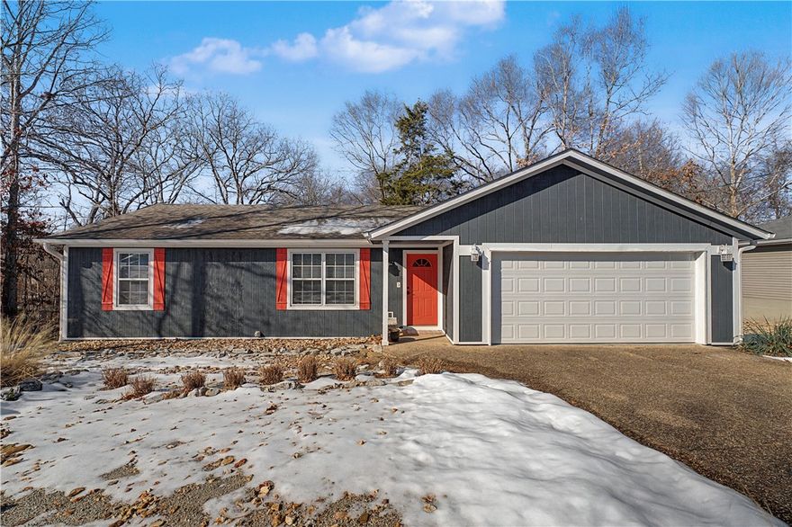 This updated 2 bed, 2 bath, 2.5 car garage home is ideally located just a few blocks from the Back 40 Mountain Biking Trail System & Metfield Recreation Complex with convenient access to Hwy-71. Thoughtfully upgraded throughout, this east-facing home features new flooring throughout the main living area & a bright, open layout filled with natural morning light. The kitchen features stainless steel appliances & lots of counter & cabinet space. The primary suite offers wood-like LVP flooring, two closets & a beautiful ensuite with dual vanities & a walk-in shower. The second bedroom also includes its own private ensuite, perfect for guests. Enjoy cozy evenings by the fireplace with custom built-in shelving or relax on the spacious 20-ft deck overlooking wooded views and local wildlife. Additional highlights include a fully repainted 2.5-car garage with extra storage, new garage door and extension-controlled dehumidifier in the crawl space. See attachment for list of all updates! NO SIGN IN YARD