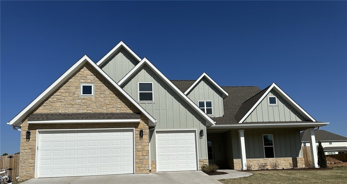 Subdivision in perfect Rogers location at the Pleasant Grove exit. This beautiful modern farmhouse design features an open floor plan designed for entertaining. Huge kitchen featuring large island, pantry, separate gas cooktop, and double oven! Main floor has a large great room, 2 bedrooms (primary suite and guest bedroom), full guest bath, office (could double as 5th bedroom), and large covered patio w/ epoxy concrete floor perfect for enjoying quiet dinners or drinks. Primary bathroom with huge ceramic tile shower, free-standing tub & large closet with built-in storage and access to laundry area. Upstairs features two additional bedrooms with "Jack-n-Jill" style bath, and huge media room with its own full bath. Great boutique shopping and upscale mall nearby. Tons of fantastic dining, the Amp, Mercy Hospital, Top Golf, trails nearby (3 minutes from Blossom Way Trailhead, connects to Razorback Greenway).