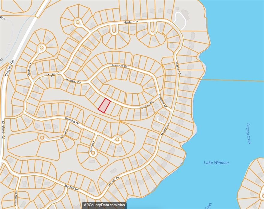 Nestled in Bella Vista's charming Mayfair subdivision, this beautiful 0.31-acre wooded lot on Heather Circle is ready for your vision. The gently sloping, forested terrain creates a naturally private setting perfect for your custom home. Perc test is required, and public water and electric are already at the street makes this an easy build. Located in the top-rated Bentonville School District and just minutes from Lake Windsor and Bella Vista's world-class biking, mountain biking, and walking trails, this is outdoor-lifestyle living at its finest. Paved road access, no flood zone, and no appointment needed — come walk the lot today!