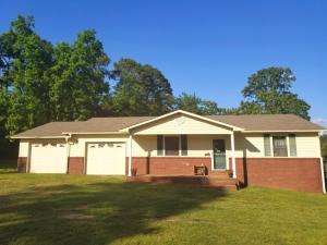 2 bedroom 2 bath home with office on 5 acres. 30 x 40 shop with concrete floor, water and electric. There is also a barn with electric, concrete floor inside and attached side shed. The backyard is fenced. Property has fenced pasture ready for horses. Above ground pool and deck convey with property. All electric, bill averages about $150 per month.