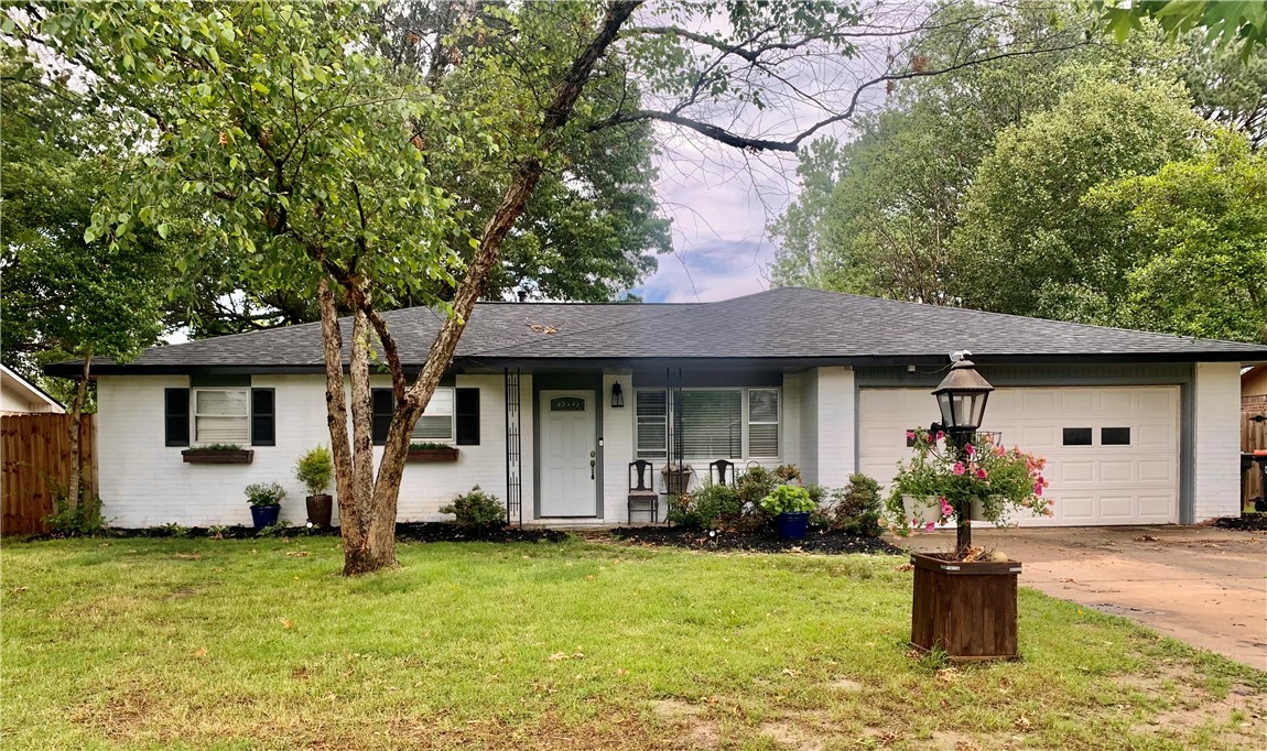 Charming convenient living! Close to everything NWA has to offer! Updated and ready for your unique touch! The expensive updates are done: Newer roof, air, water heater, interior and exterior paint. Minutes to schools, shopping, trails, health care. This home has a huge level privacy fenced back yard.