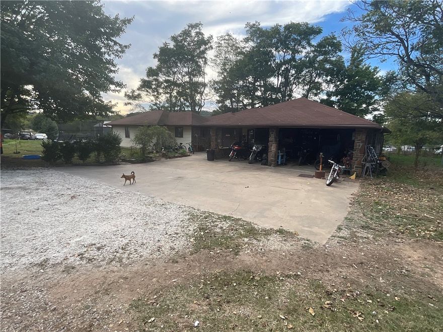 Check out this large, spacious 3-bedroom, 2362 SF home on 1.8 acres! This home features a beautiful kitchen with a large island, custom cabinets, built-in wall oven and a cooktop. There is also a 30x30 shop. Located just 20 minutes from the UofA and close to Prairie Grove schools and shopping.